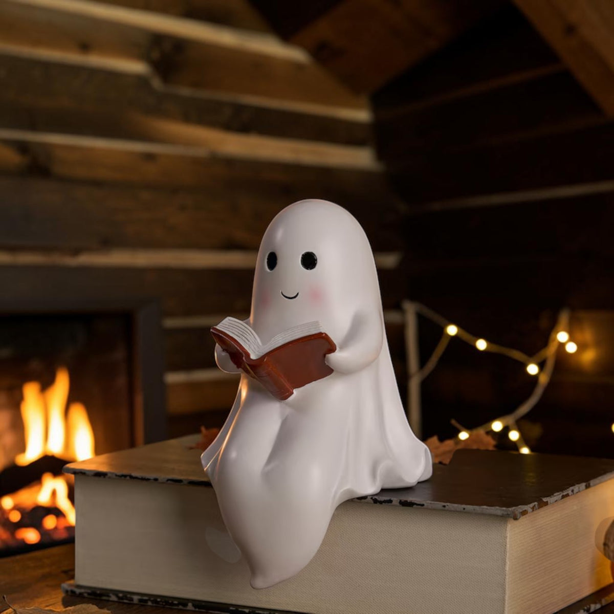 LED reading ghost night light on bookshelf, view 2