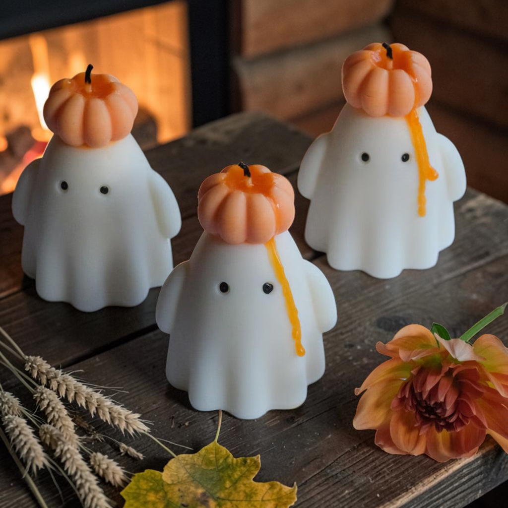 Soy wax ghost candle wearing a pumpkin hat, view 2