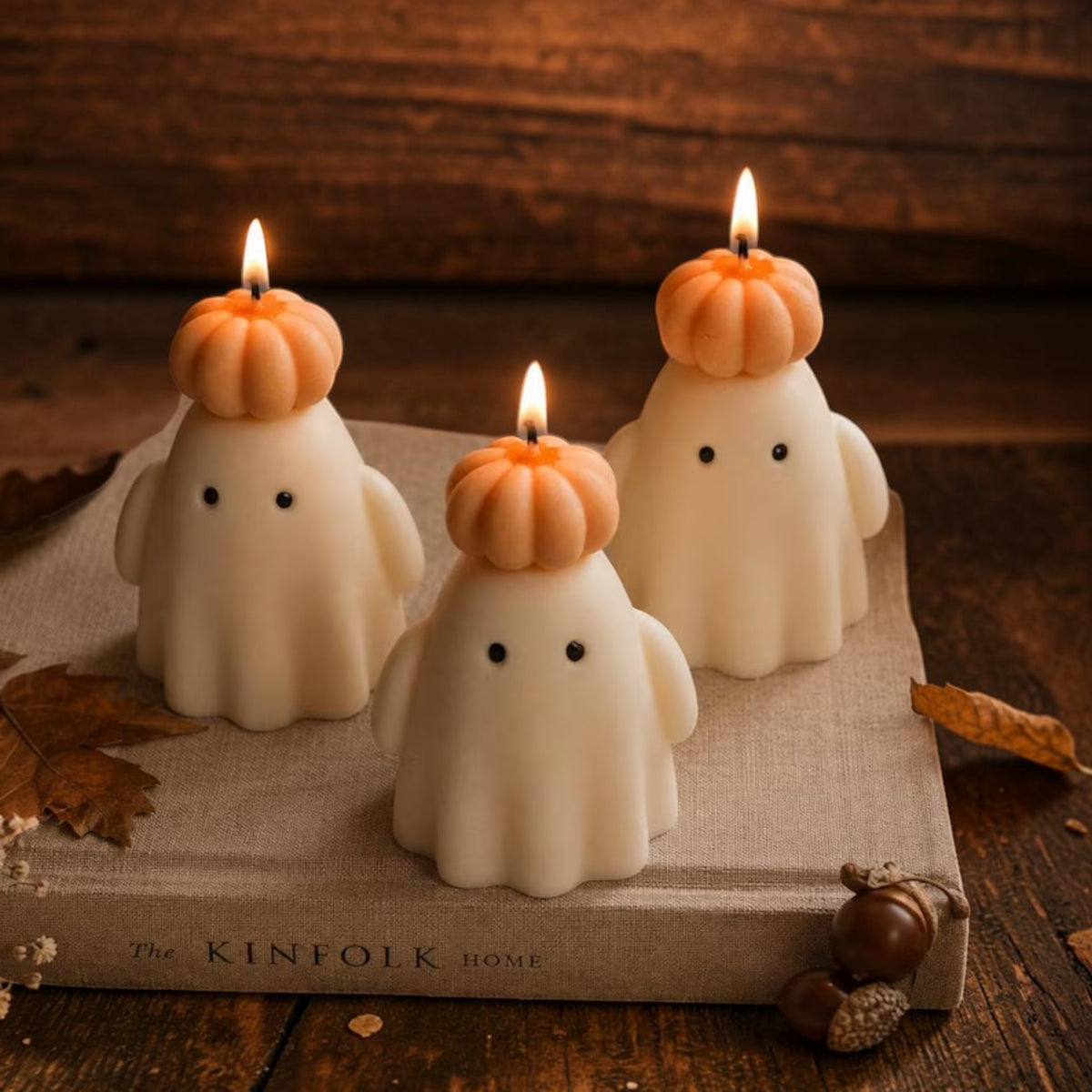 Soy wax ghost candle wearing a pumpkin hat, view 3